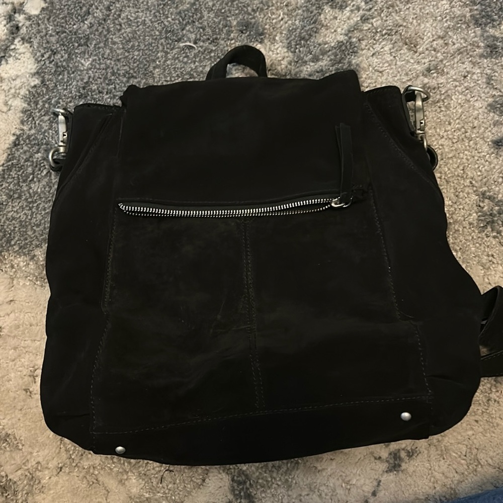 Free people black handbag.  Has straps for backpack.  Review pictures